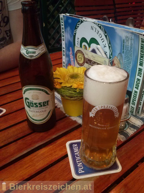 Foto eines Bieres der Marke Gösser NaturGold aus der Brauerei Brauerei Göss