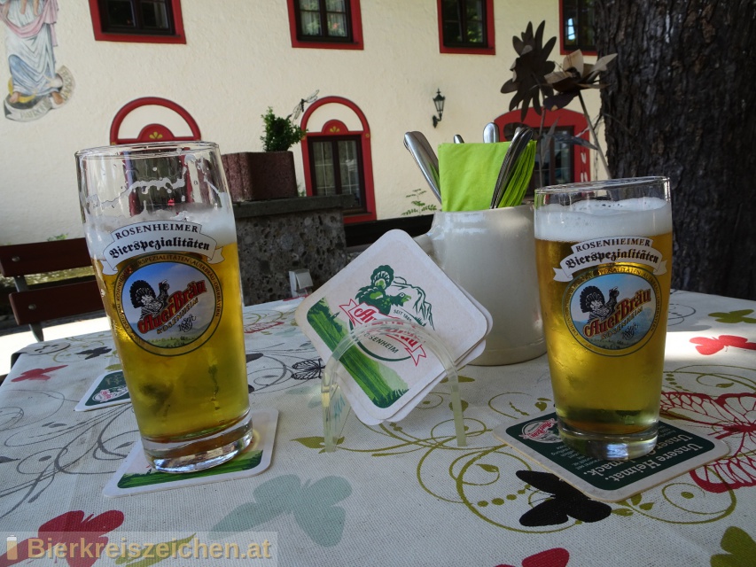 Foto eines Bieres der Marke Rosenheimer Helles aus der Brauerei Auerbru