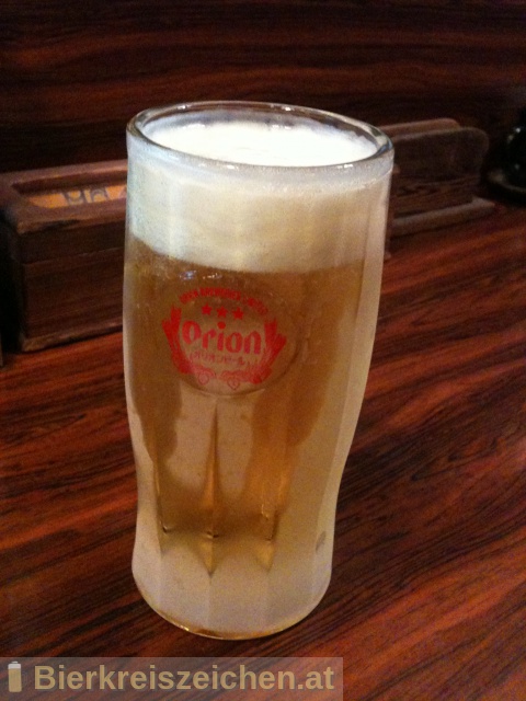 Foto eines Bieres der Marke Orion Draft Beer aus der Brauerei Orion Bīru Kabushiki Gaisha